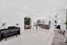 Polished tile flooring, crown molding, recessed lighting, and a decorative arched entryway featuring recessed wall niches