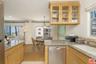KITCHEN AND VIEW OF DINING ARE