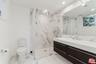 Bathroom with glass-enclosed s