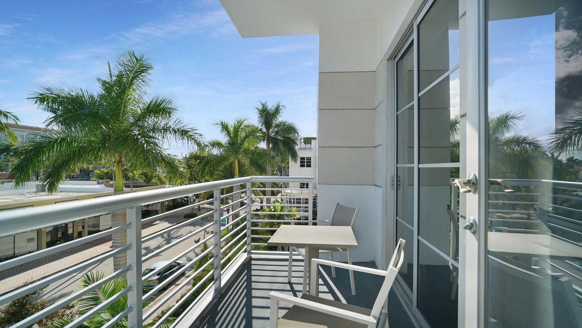 Private terrace overlooking the landscaped courtyard at Tower 155 in Downtown Boca Raton.