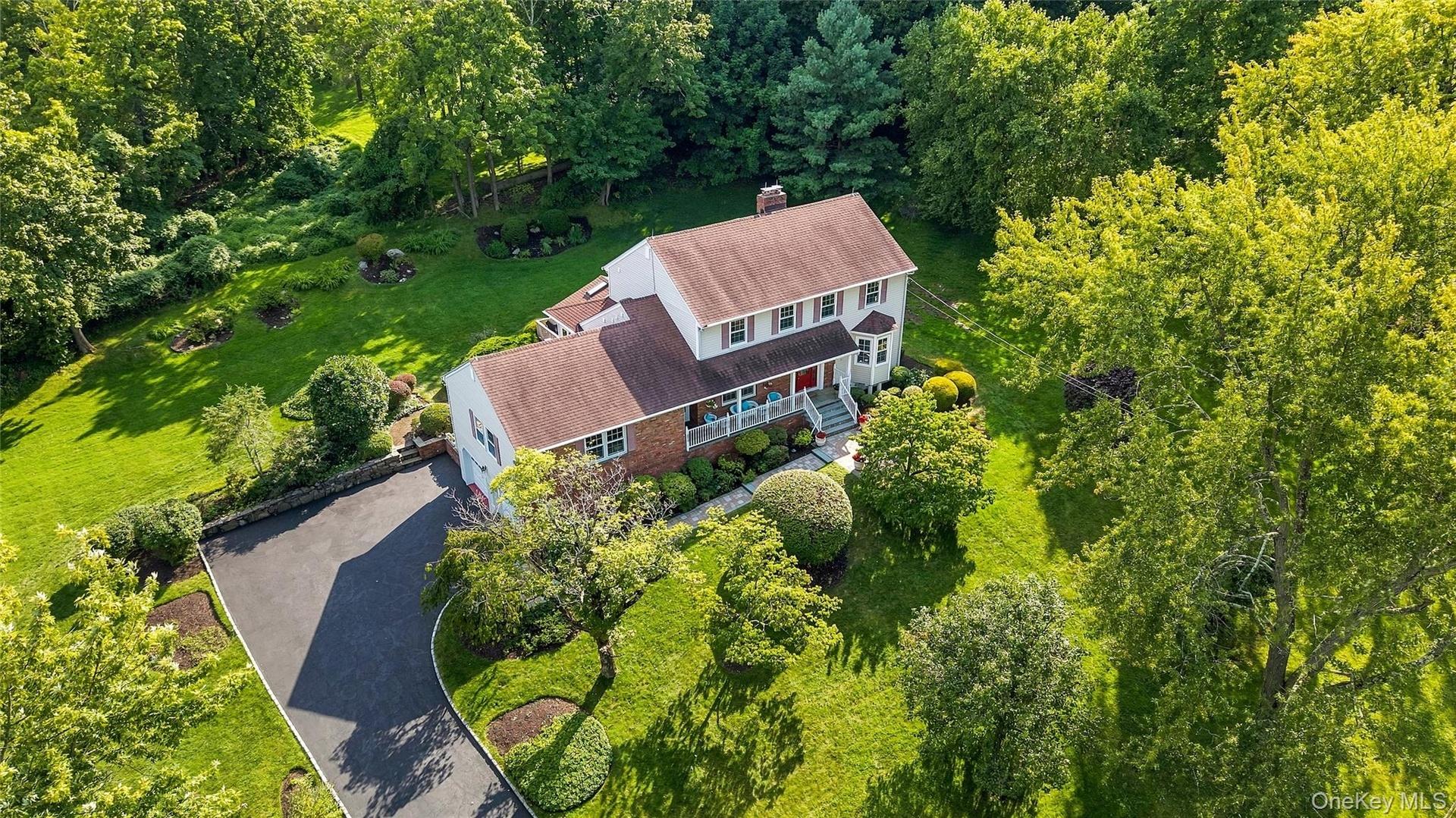 Welcome Home to 110 Cypress Lane in Briarcliff Manor, a 5 BR, 3 1/2 bathroom colonial on over 1.5 acres of beautifully landscaped property