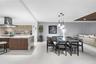 An elegant dining area offering beautiful waterfront views and a seamless setting for entertaining.