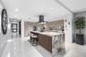 A sophisticated Italian-designed kitchen featuring custom cabinetry, premium Gaggenau appliances, gas cooking and an elegant island ideal for entertai