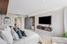 The primary suite is privately positioned at the opposite end of the residence, separate from the additional bedrooms.