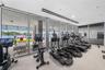 A private, state-of-the-art fitness center featuring premium equipment in an intimate setting.