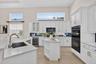 Newly refreshed kitchen includes quartz counterops