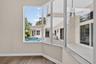 Easy to work from this space with a serene view of the pool