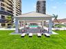 A spacious covered pavilion overlooks the pool and manicured recreation lawn, creating an inviting setting for lounging, dining and gathering with fri