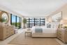 The oversized primary suite offers an exceptional four walk-in closets, delivering abundant storage and dressing space rarely found in a condominium r