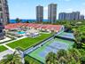 Martinique 2’s expansive amenity grounds bring together landscaped lawns, tennis courts, shaded gathering spaces and the resort-style pool in one beau