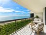 Front-row Oceanfront living: the expansive covered oceanfront terrace places the beach and open ocean directly in front of Penthouse 401.