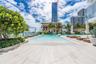 Private man-made beach and daybeds on Biscayne Bay
