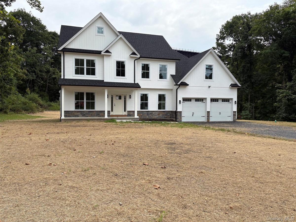 Beautiful colonial situated on level property surrounded by forever green.