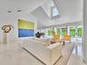 Soaring ceilings and expansive French doors, create a light-filled interior, with crisp lines and refined finishes bringing a distinctly modern sensib