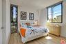 Bright primary bedroom with ta
