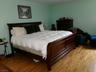 Primary Br w / hardwood floors