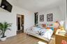 Bright primary bedroom with ta