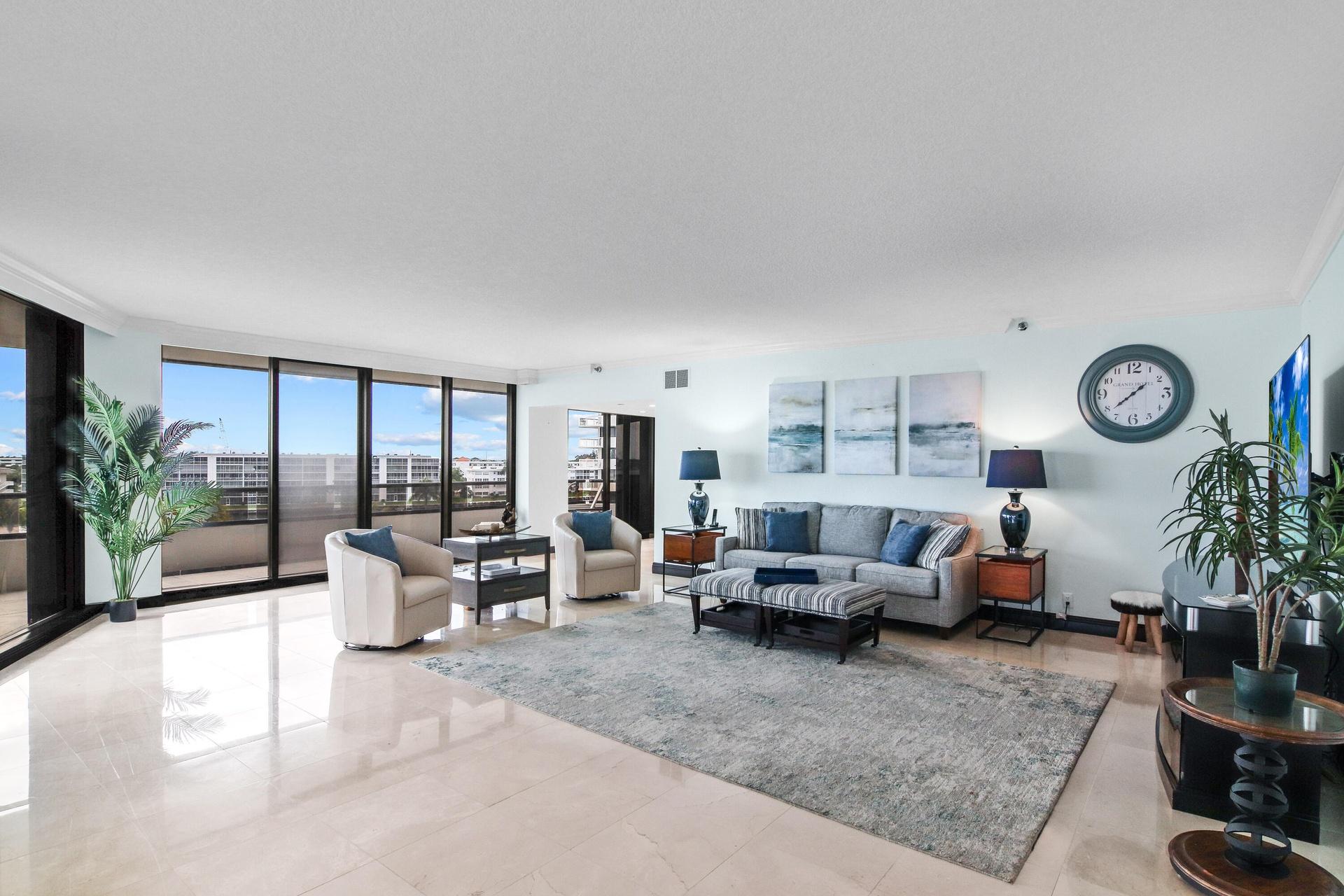 Living Room 1 - All sliders have electric shades.