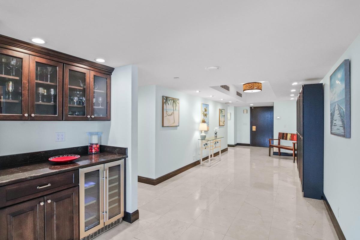 Condo Entrance into Huge Lobby (see built-in bar)