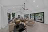 Living area with beautiful cathedral ceiling and a view of the pool