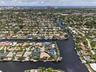 Aerial view Beautiful point lot home with wide waterfront for your boating enjoyment with Fort Lauderdale Beach in the background