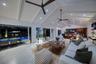 Gorgeous cathedral ceilings enhance the home’s spaces and character looking out toward the pool