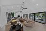 Living area opens to the pool and back patio for enjoyment and entertainment.