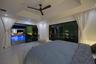 Night view from second primary bedroom overlooking pool and waterfront