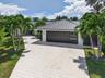 Aerial view of two car garage and paver driveway. Plenty of parking.