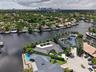 Aerial view of point lot waterfront home with view of downtown Fort Lauderdale