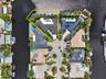 Aerial view of home on gorgeous point lot outlined in yellow