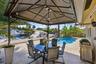 40' Dock, 70' Seawall (2026), 15' x 3' Freeform Pool with Rock Waterfall, Covered Patio, Aluminum Roof & Travertine Patio Pavers 2024