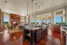 Centered around a statement island, this beautifully designed kitchen keeps the cook connected to every conversation, every meal, and every memorable 