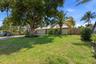 You will Love the Big Tree in the Front Yard, Big Yard & Wide Gate to the Back on the South Gate.
