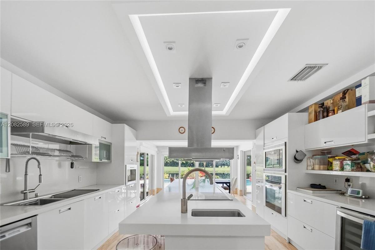Modern kitchen with a large island and sleek finishes.