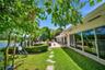 Lush private garden with tropical landscaping, peaceful lake views, and direct access to the poolside terrace.