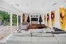 Spacious home theater/media room with built-in audiovisual components and Pioneer entertainment system.