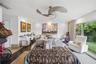 Generously sized primary bedroom featuring modern finishes and floor-to-ceiling garden views.