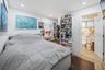 Cozy Secondary Bedroom 1 featuring a private en-suite bathroom and a bright, comfortable layout.