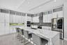 Chef's kitchen w/ counter seating, quartz waterfalls, 2 ovens, pot filler, tons of storage, KraftMaid cabinets