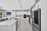 Chef's kitchen w/ counter seating, quartz waterfalls, 2 ovens, pot filler, tons of storage, KraftMaid cabinets