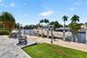 New concrete dock and seawall with 20k electric boat lift, 50 amp electric and water in dock pedestal, fish cleaning station and dock ladder