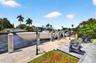 New concrete dock and seawall with 20k electric boat lift, 50 amp electric and water in dock pedestal, fish cleaning station and dock ladder