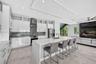 Chef's kitchen w/ counter seating, quartz waterfalls, 2 ovens, pot filler, tons of storage, KraftMaid cabinets