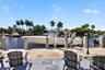 New concrete dock and seawall with 20k electric boat lift, 50 amp electric and water in dock pedestal, fish cleaning station and dock ladder
