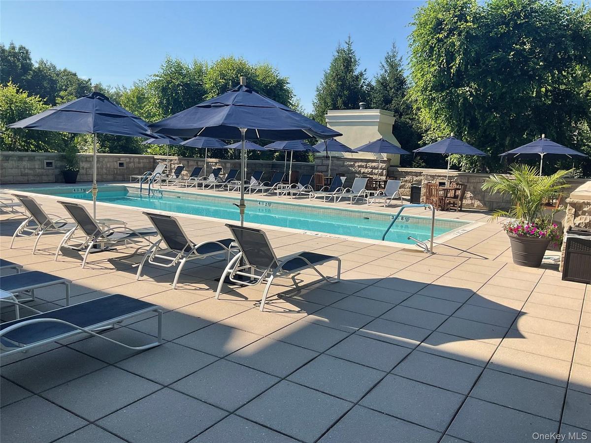 Resort-style living continues outdoors with a secluded pool and spacious sun deck.
