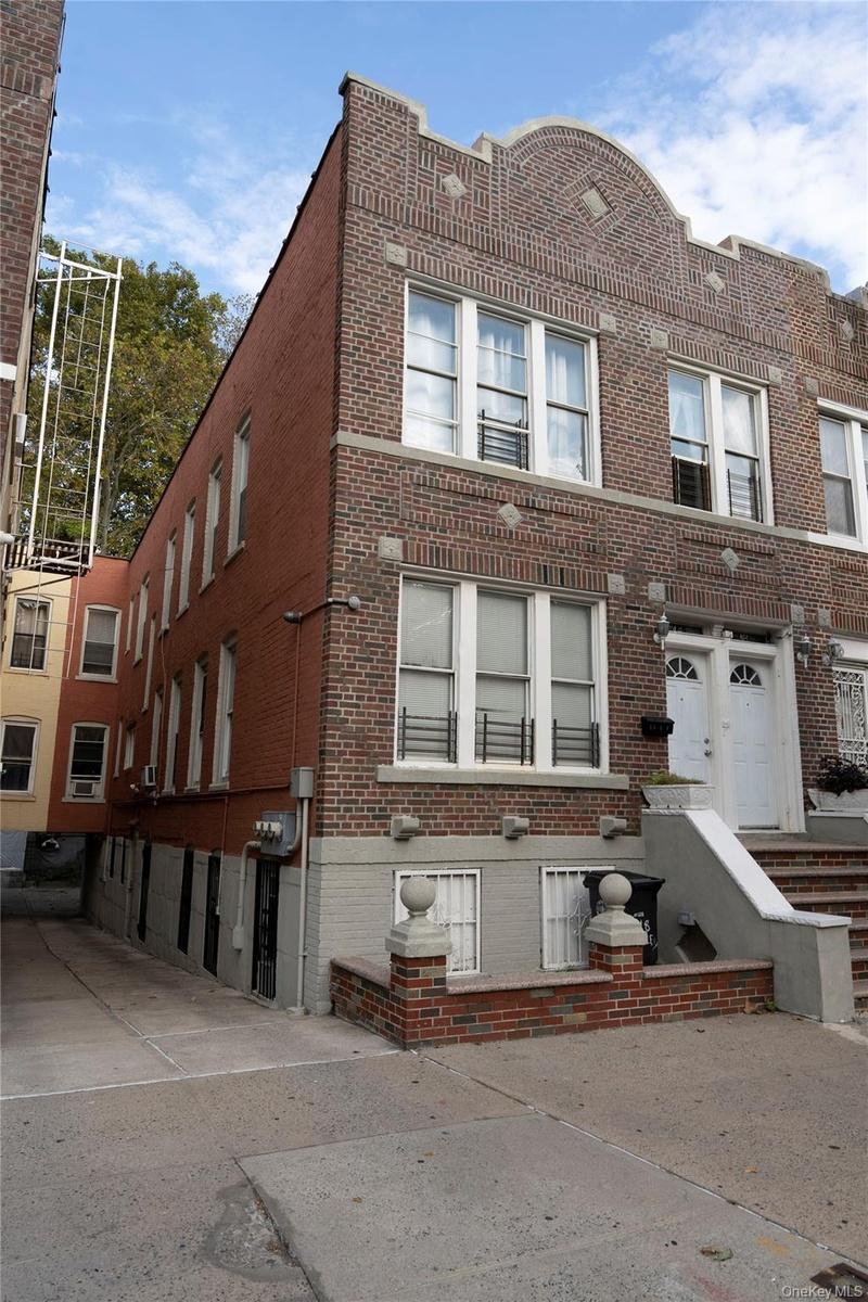 Brick facade featuring decorative stone accents and multiple windows