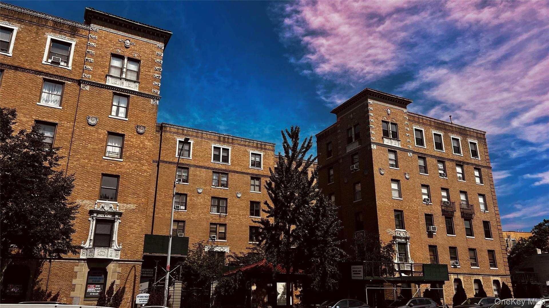 Multi-story brick facade buildings featuring decorative cornices and window surrounds