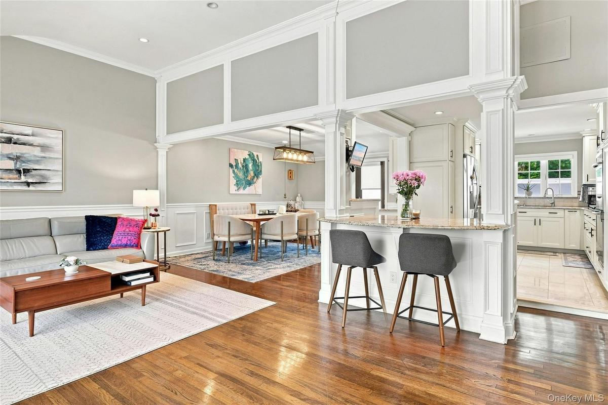 Custom molding surrounds the vaulted ceiling