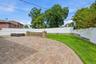 Paver patio with custom stone seating area